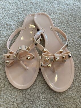 Nude studded jelly bow sandals